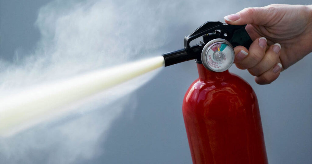 fire extinguisher discharging